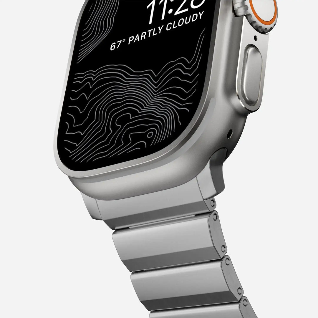 Men's sleek titanium watch band with shiny finish, magnetic clasp, durable and lightweight; perfect for daily or formal wear.