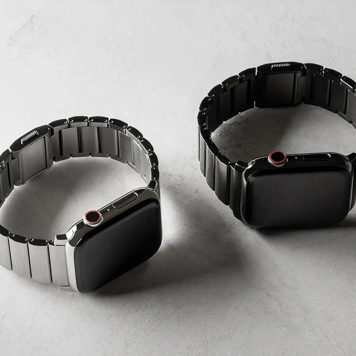 Men's sleek titanium watch band with shiny finish, magnetic clasp, durable and lightweight; perfect for daily or formal wear.