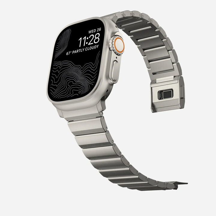 Men's sleek titanium watch band with shiny finish, magnetic clasp, durable and lightweight; perfect for daily or formal wear.