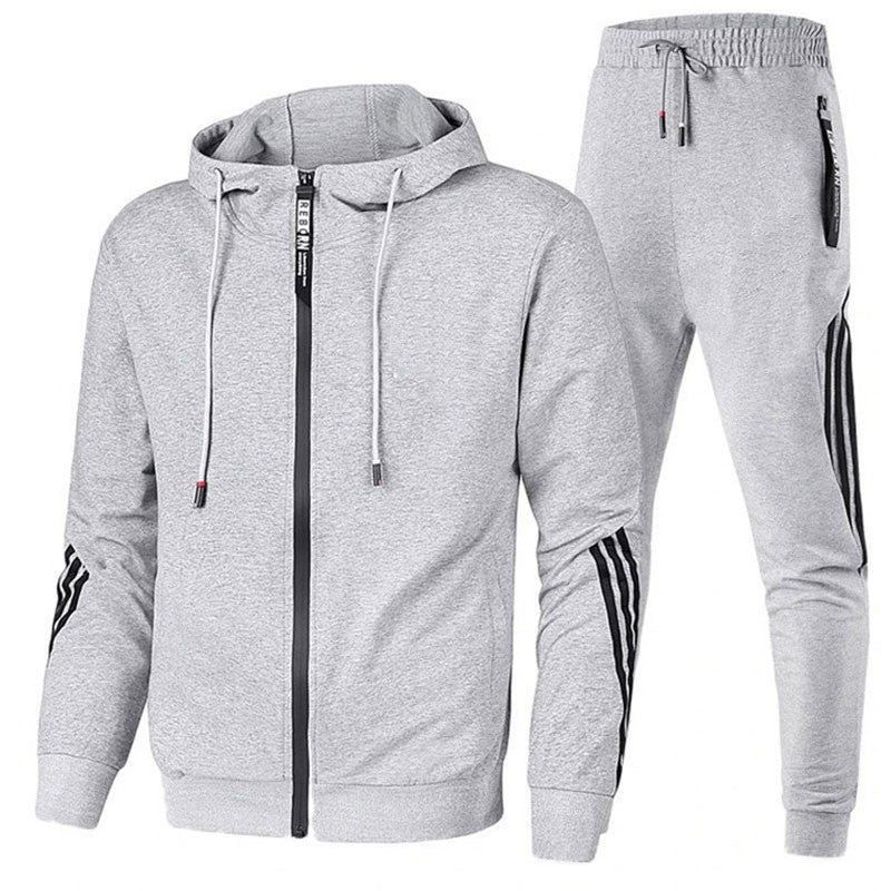 "Men's stylish two-piece tracksuit in black, side view, relaxed fit, versatile design, ideal for casual or active wear."