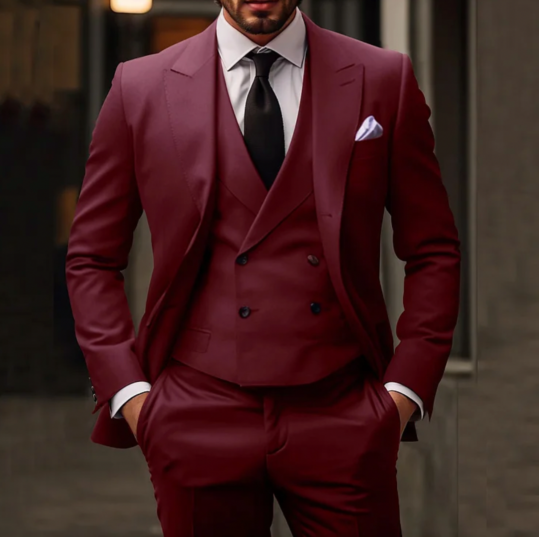 Men's tailored suit with single-breasted jacket, double-breasted vest, and slim trousers in formal stylish design.