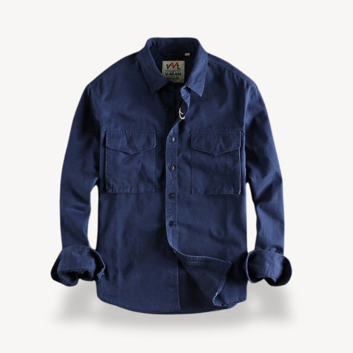 "Men's washed cotton cargo work shirt with pockets, in classic blue, featuring two chest pockets and durable stitching."