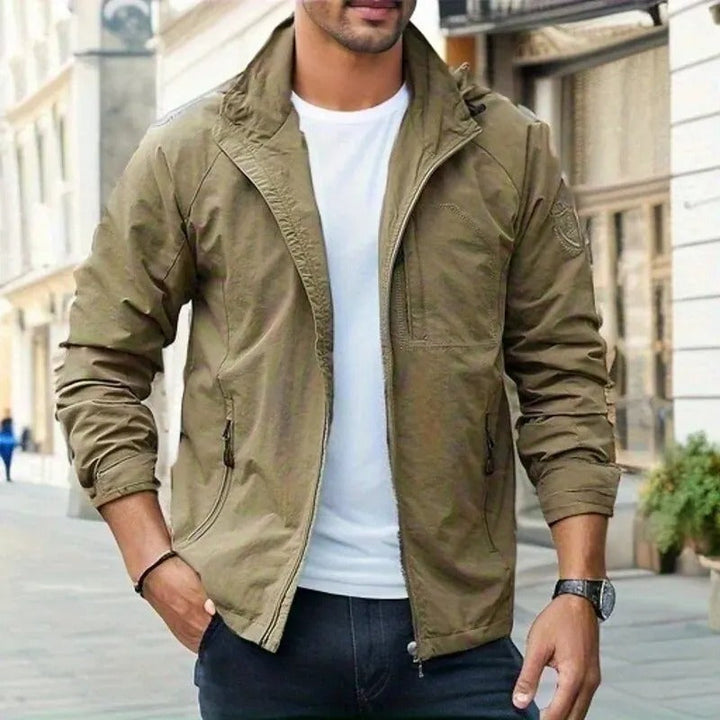 "Men's waterproof breathable cargo summer jacket with multiple pockets, perfect for outdoor adventures and summer showers."