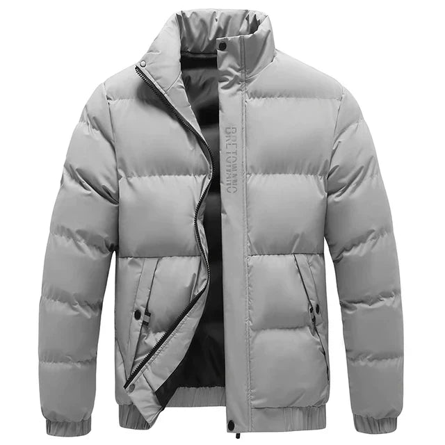 "Men's winter jacket in gray sharkskin fabric, featuring a sleek design with multiple pockets and a snug fit for outdoor wear
