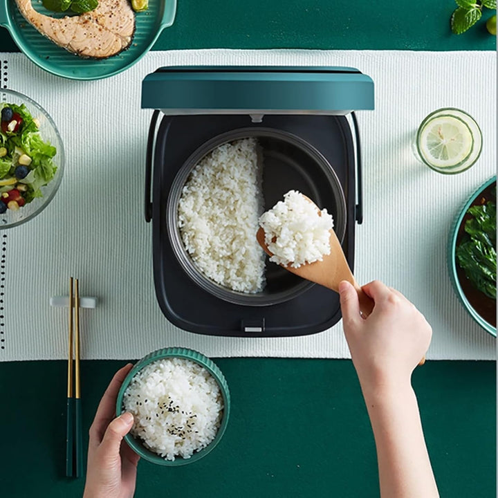 "Mini rice cooker and steamer, compact design for 1-2 people, 1.2L capacity, in green, ideal for small kitchens or travel."