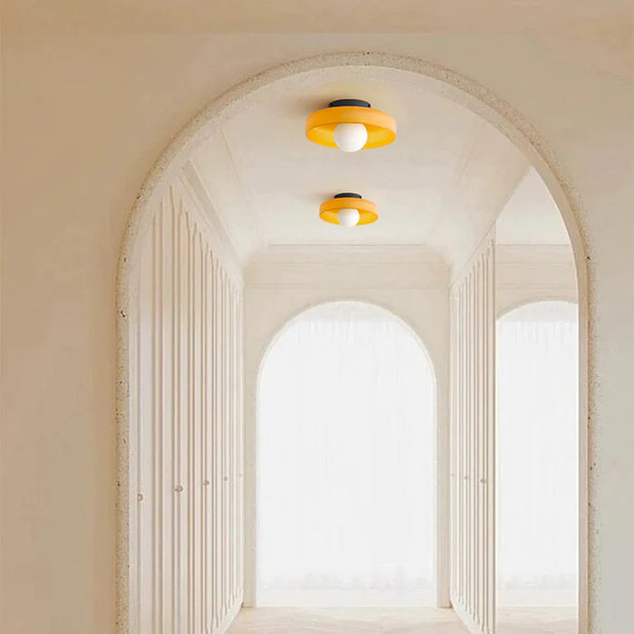"Minimal flush mount ceiling light with frosted shade, sleek finish, offers soft illumination; ideal for modern and tradition