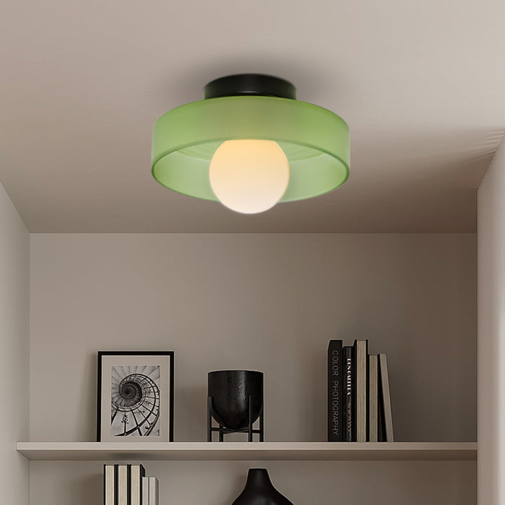 "Minimal flush mount ceiling light with frosted shade, sleek finish, offers soft illumination; ideal for modern and tradition