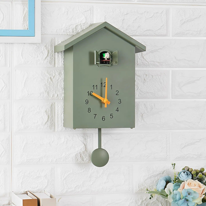 "Minimalist cuckoo wall clock with sleek black and white finish, modern design, whimsical bird element, compact 20x25cm size.