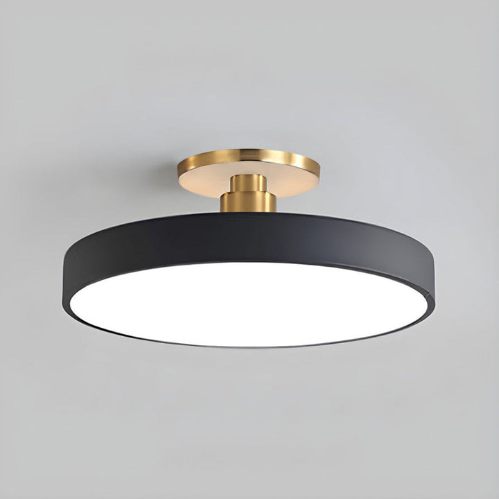 "Minimalist LED ceiling light, semi-flush design, brightens spaces with elegant style and energy-efficient glow."