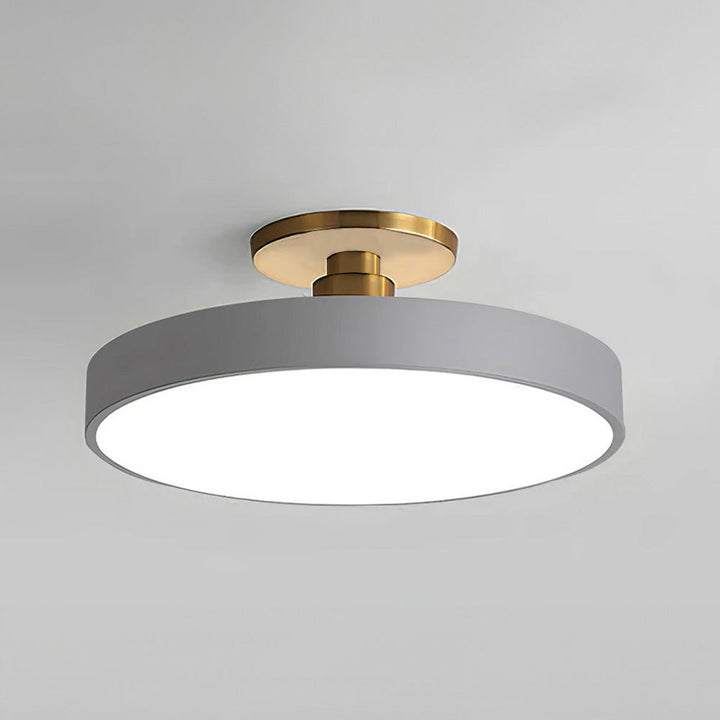 "Minimalist LED ceiling light, semi-flush design, brightens spaces with elegant style and energy-efficient glow."