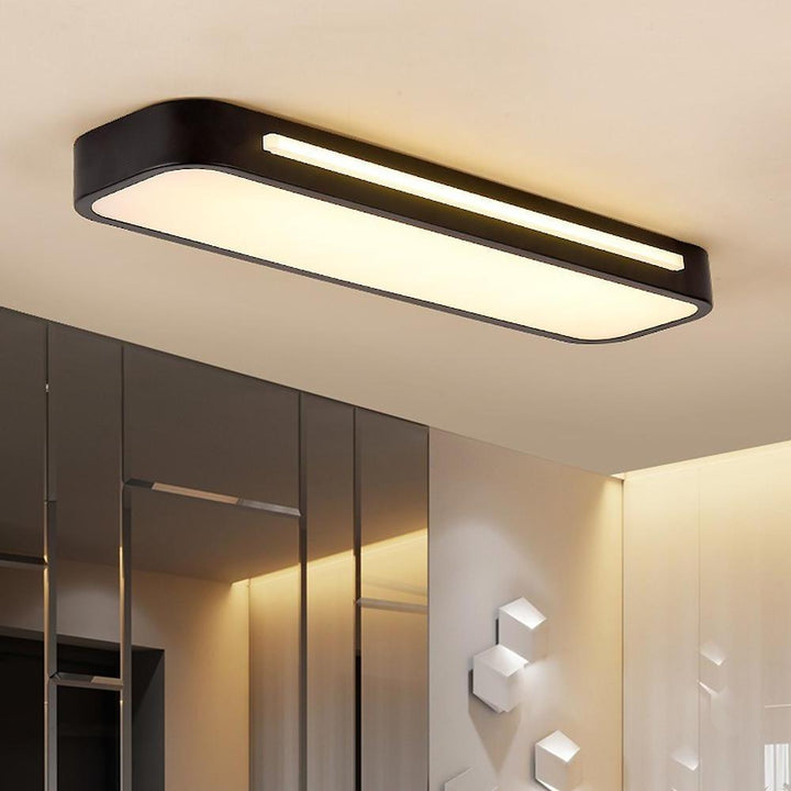 "Minimalist Nordic long LED ceiling light with sleek black finish and modern design for elegant interior lighting"