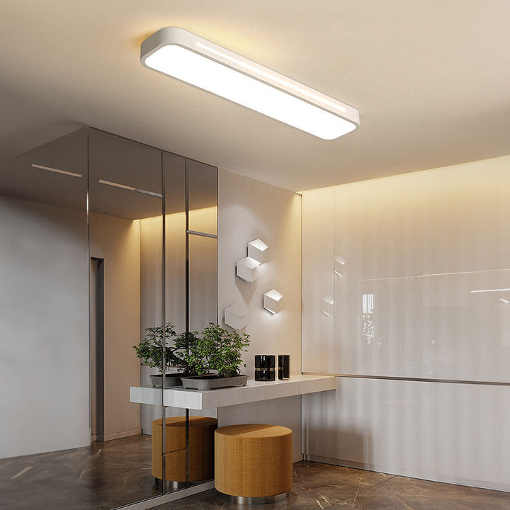 "Minimalist Nordic long LED ceiling light with sleek black finish and modern design for elegant interior lighting"