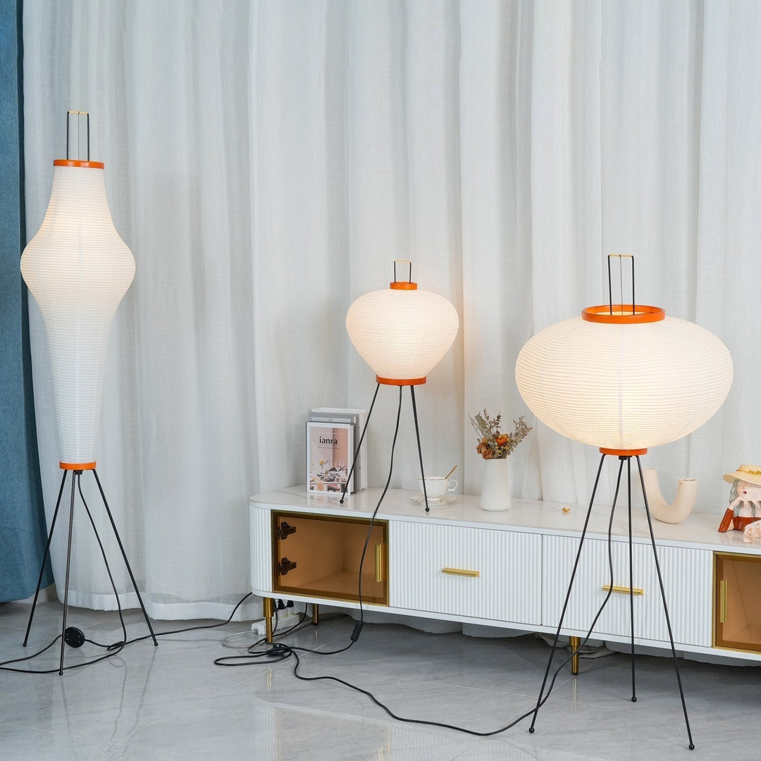 "Minimalist rice paper floor lamp with sleek metal frame and soft diffused light, perfect for creating a warm ambiance."