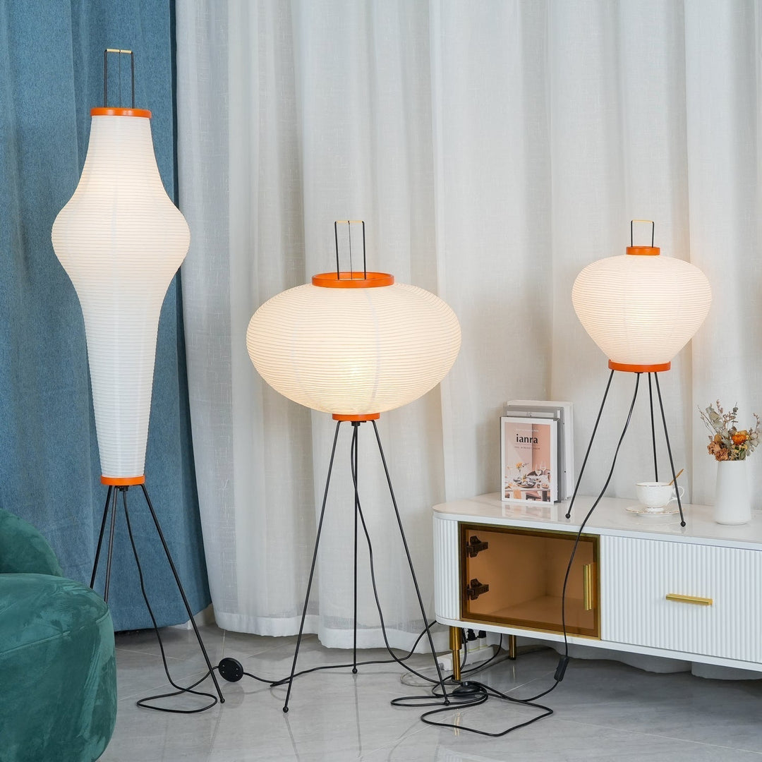"Minimalist rice paper floor lamp with sleek metal frame and soft diffused light, perfect for creating a warm ambiance."