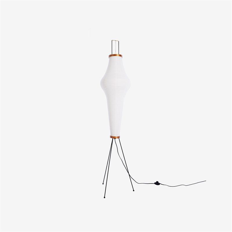 "Minimalist rice paper floor lamp with sleek metal frame and soft diffused light, perfect for creating a warm ambiance."