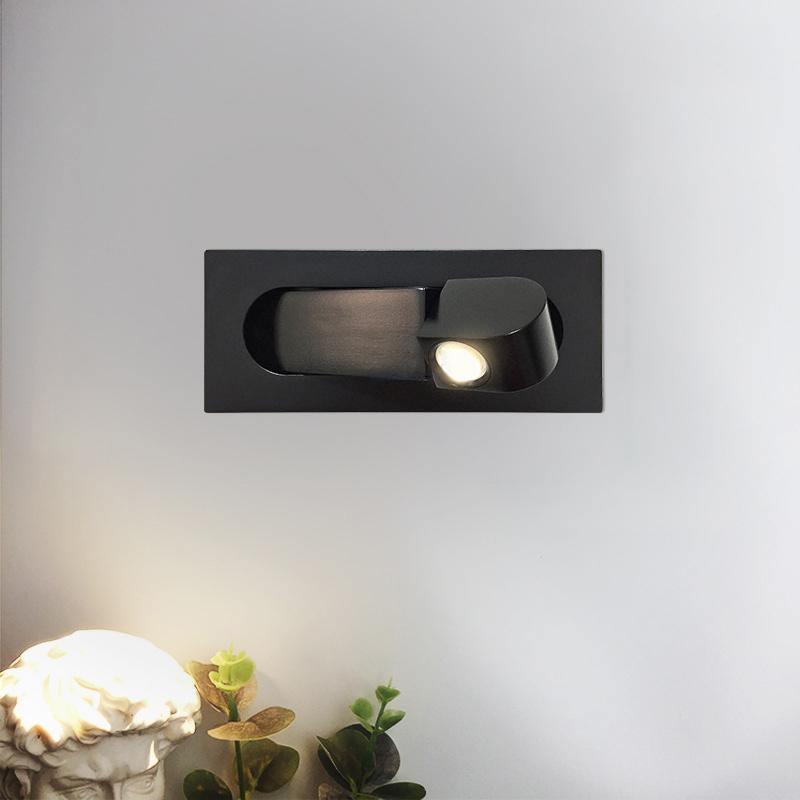 Modern adjustable LED bedside lamp in matte black with a sleek design, featuring an adjustable head for focused reading light