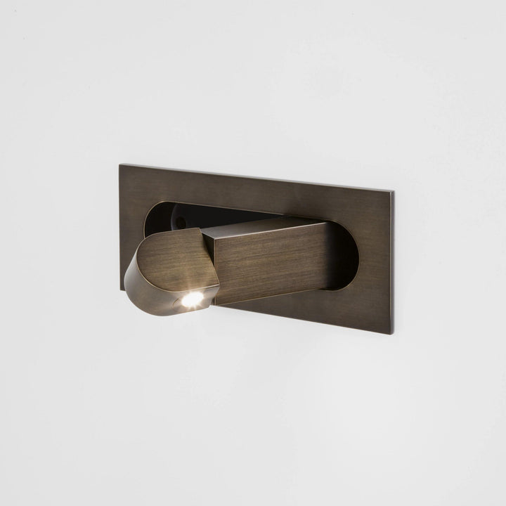 Modern adjustable LED bedside lamp in matte black with a sleek design, featuring an adjustable head for focused reading light