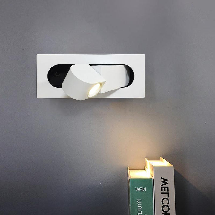 Modern adjustable LED bedside lamp in matte black with a sleek design, featuring an adjustable head for focused reading light
