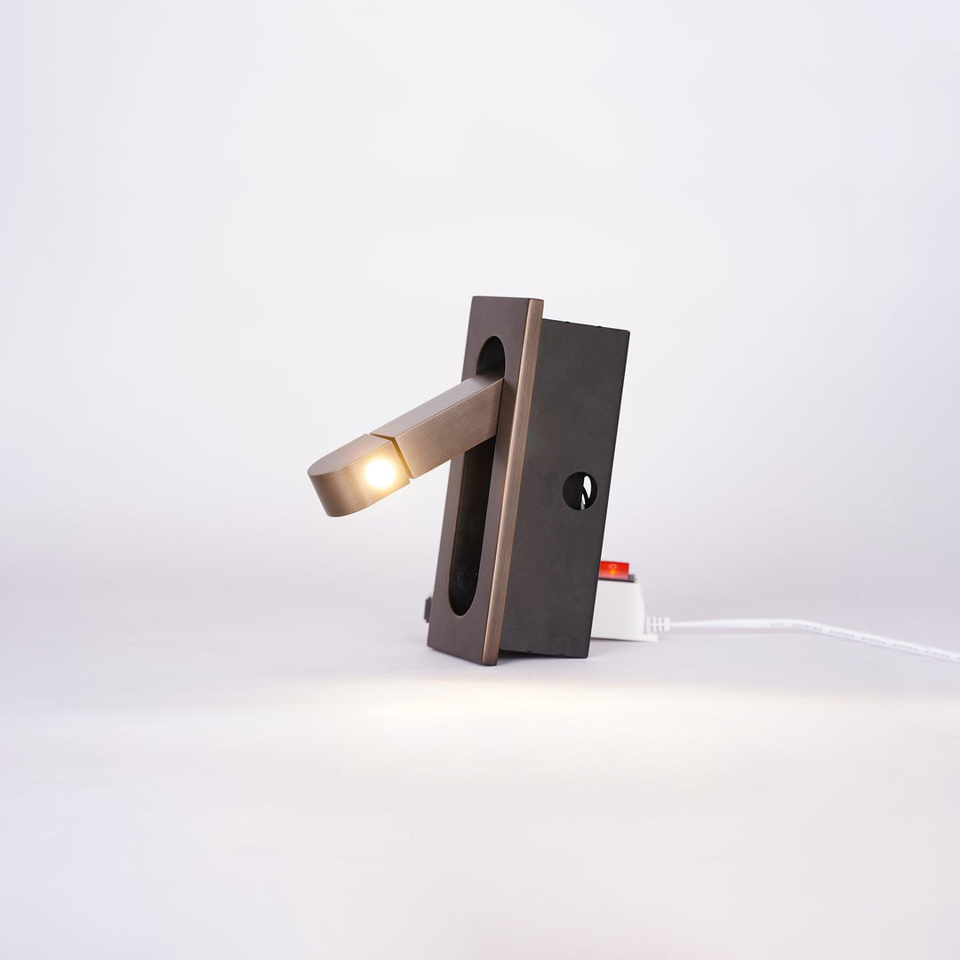 Modern adjustable LED bedside lamp in matte black with a sleek design, featuring an adjustable head for focused reading light