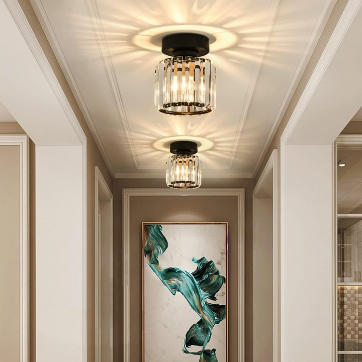 Modern black crystal flush mount ceiling light, sleek brass fixture, crystal shade, ideal for rooms with low ceilings.
