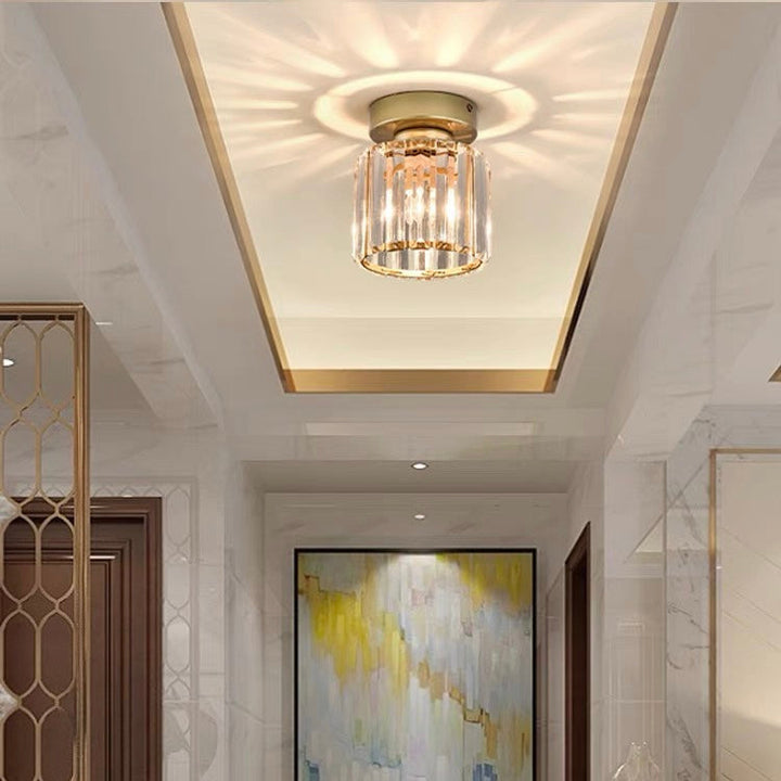Modern black crystal flush mount ceiling light, sleek brass fixture, crystal shade, ideal for rooms with low ceilings.