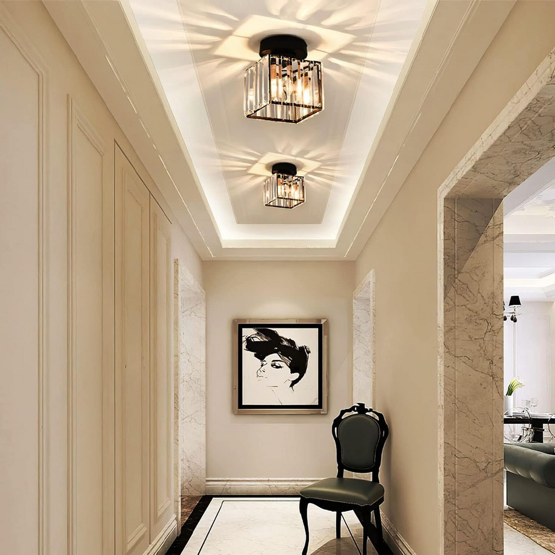 Modern black crystal flush mount ceiling light, sleek brass fixture, crystal shade, ideal for rooms with low ceilings.