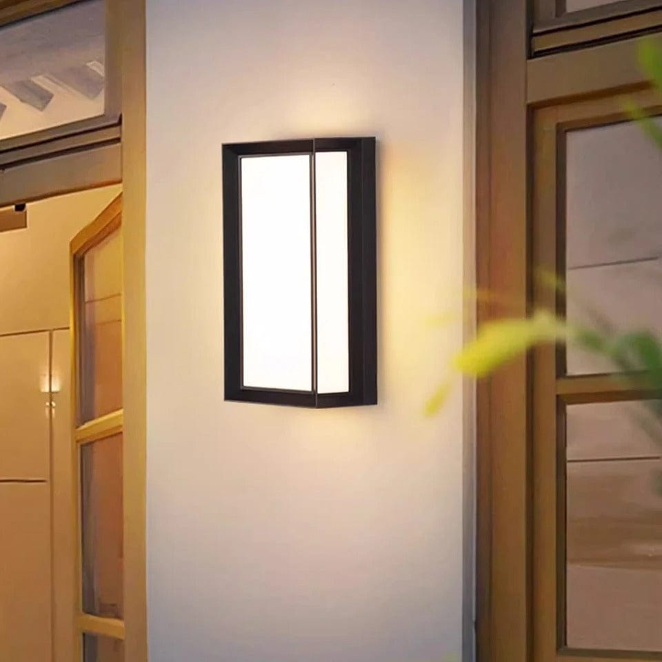 Modern black LED outdoor wall light with motion sensor, waterproof ABS, enhances security, suits balconies, porches, gardens.