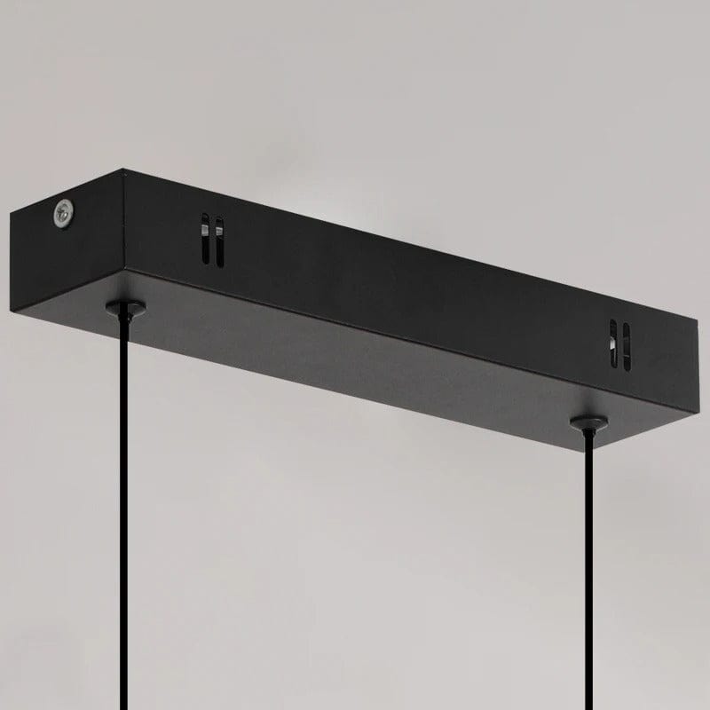 "Modern black pendant light with tubular silhouette, minimalist aluminium fixture, perfect for dining rooms and kitchens."