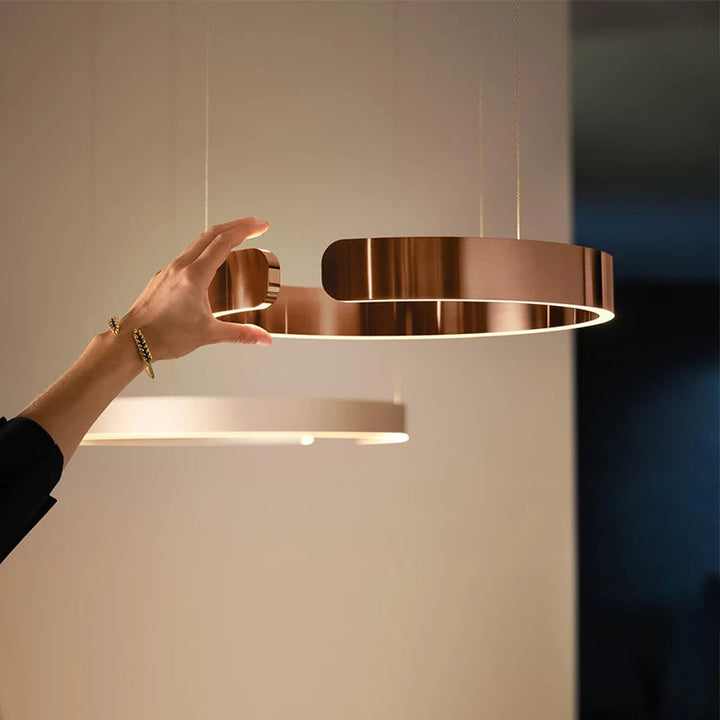 "Modern circular LED pendant light in minimal design, black finish, ideal for elegant home interiors and efficient lighting."