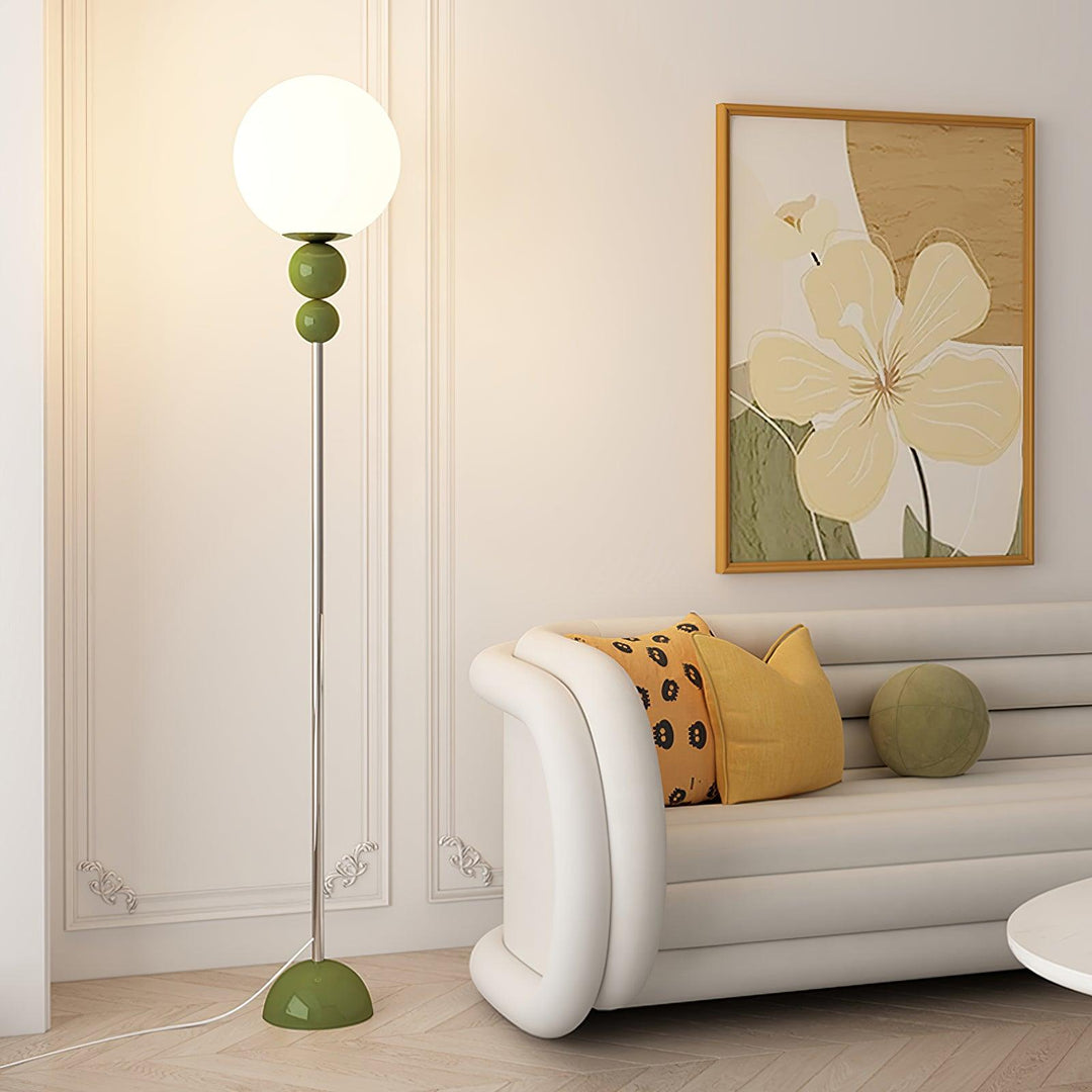 Modern Clavel metal floor lamp with glass accent, 59-inch height, sleek modern design, adds elegance to any room decor.