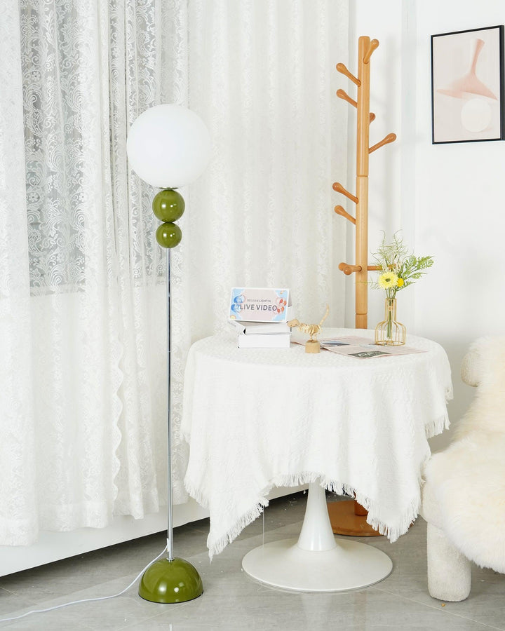 Modern Clavel metal floor lamp with glass accent, 59-inch height, sleek modern design, adds elegance to any room decor.