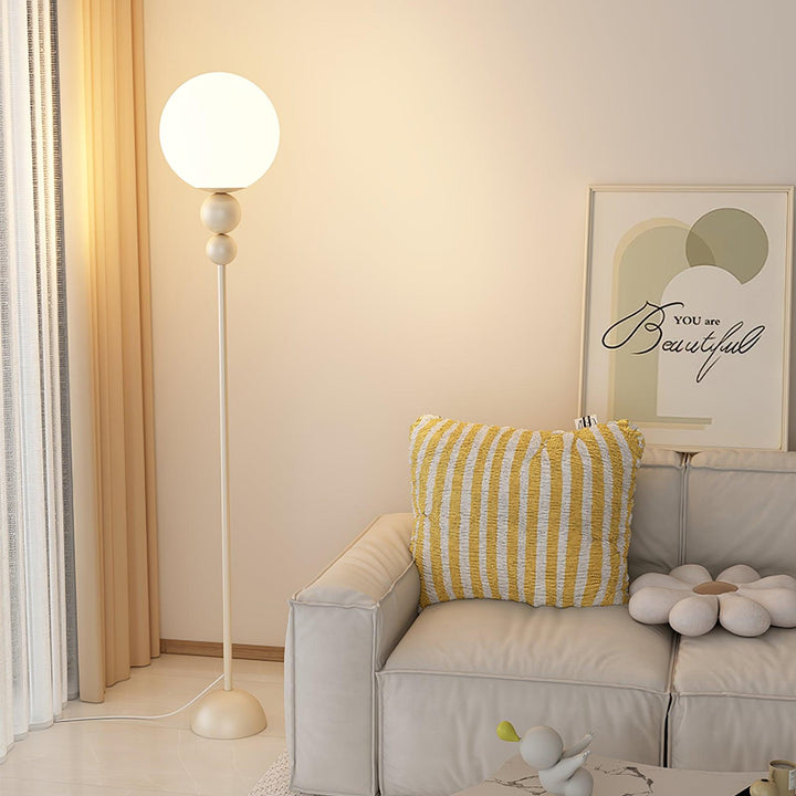 Modern Clavel metal floor lamp with glass accent, 59-inch height, sleek modern design, adds elegance to any room decor.