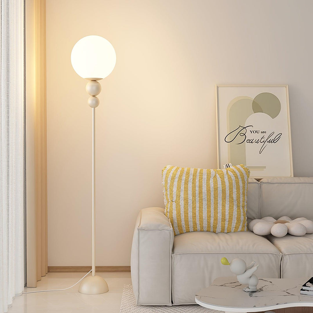 Modern Clavel metal floor lamp with glass accent, 59-inch height, sleek modern design, adds elegance to any room decor.