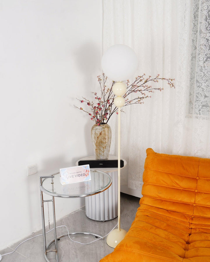 Modern Clavel metal floor lamp with glass accent, 59-inch height, sleek modern design, adds elegance to any room decor.