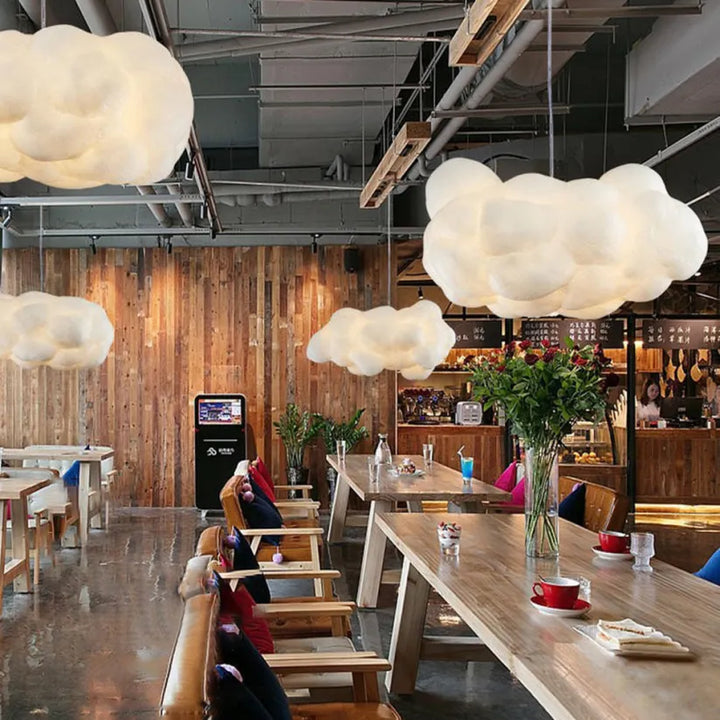 "Modern cloud-inspired pendant light with a soft ambient glow, featuring a dreamy design for elegant home decor spaces."
