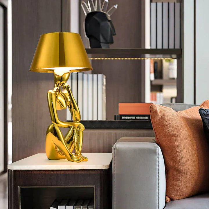 Modern designer table lamp for elegant ambient lighting. Perfect for contemporary home decor in living rooms or bedrooms.