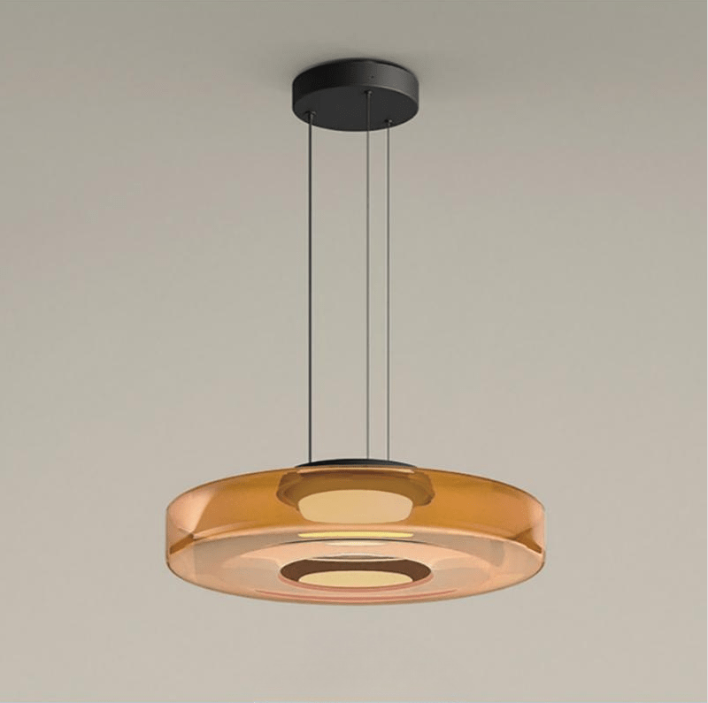 "Modern glass pendant lamp in Bauhaus design, smoke grey shade, adjustable cable, warm LED glow, ideal for home interiors."