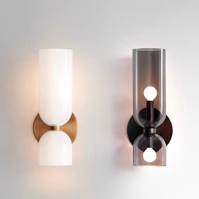 "Modern glass twin wall light with dual glass shades, ideal for stylish interiors, adding elegance and versatile illumination