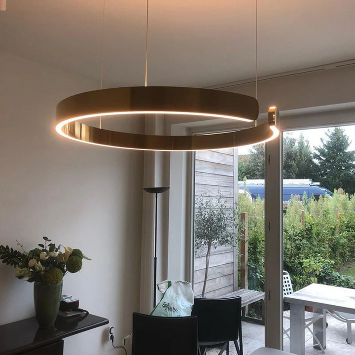 Modern HaloRing LED pendant light. Elegant circular design, dimmable, perfect for contemporary living spaces.