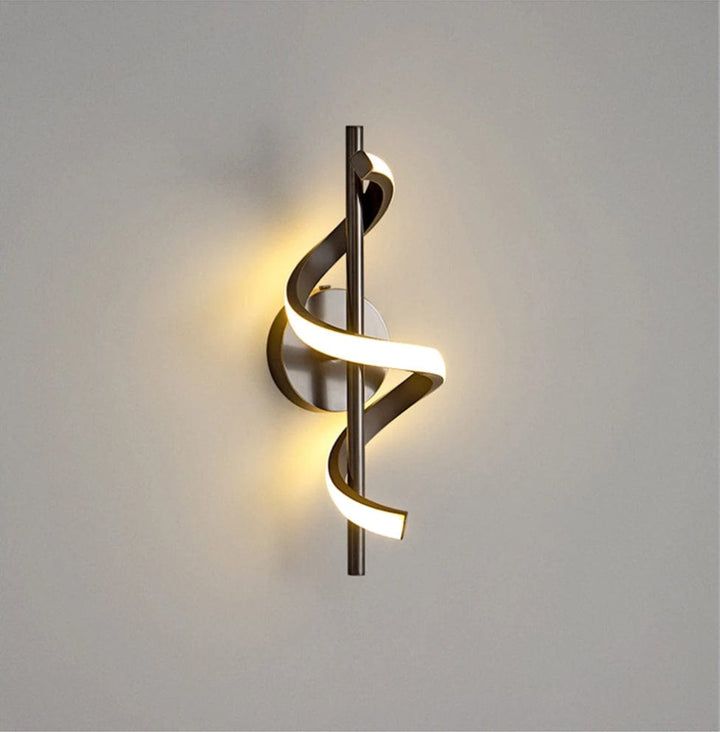 Modern LED wall sconce with adjustable gold arm and copper finish, ideal for ambient lighting in living rooms and bedrooms.