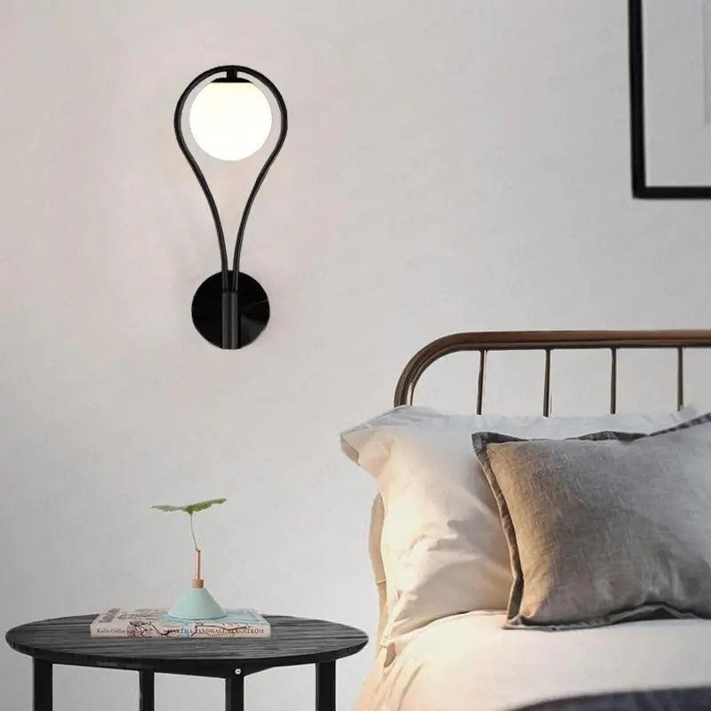 "Modern Nordic wall lamp with elegant gold and black finish, featuring minimalist design and clean lines for any room decor."