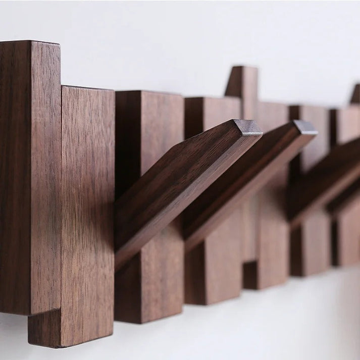 Compact piano key coat rack, 6 hooks, made of wood. Perfect for stylish home organization in hallways.
