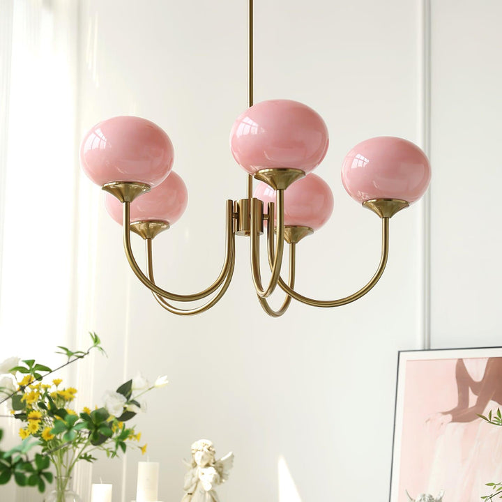 Modern pink and gold chandelier with elegant glass shades, ideal ceiling light fixture for chic home decor and illumination.