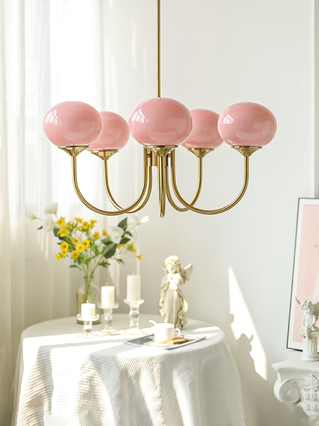 Modern pink and gold chandelier with elegant glass shades, ideal ceiling light fixture for chic home decor and illumination.