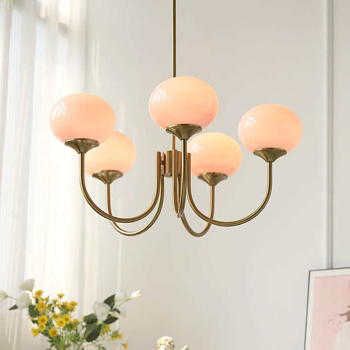 Modern pink and gold chandelier with elegant glass shades, ideal ceiling light fixture for chic home decor and illumination.