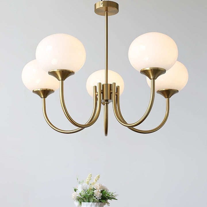 Modern pink and gold chandelier with elegant glass shades, ideal ceiling light fixture for chic home decor and illumination.