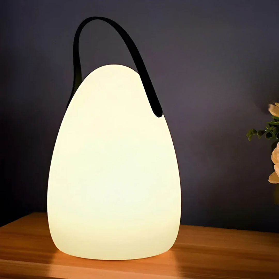 Portable waterproof LED table lamp, wireless & rechargeable. Modern design with RGB color changing lights for any space.