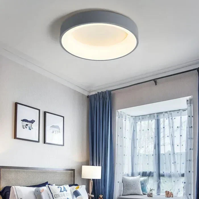 Sleek round LED ceiling lamp with minimalist design, ideal for modern Scandinavian homes. Bright, energy-efficient light.