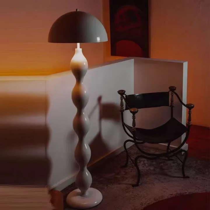 "Modern Scandinavian floor lamp with sleek metal frame and glowing shade in minimalist design for contemporary home decor."