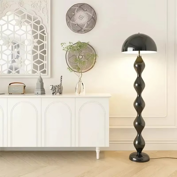 "Modern Scandinavian floor lamp with sleek metal frame and glowing shade in minimalist design for contemporary home decor."